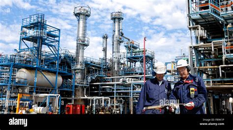 Oil And Gas Workers Inside Large Refinery Stock Photo Alamy