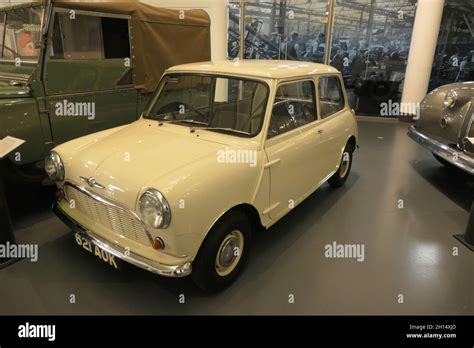 Cream mini car old style famous white vintage classic parked view ...