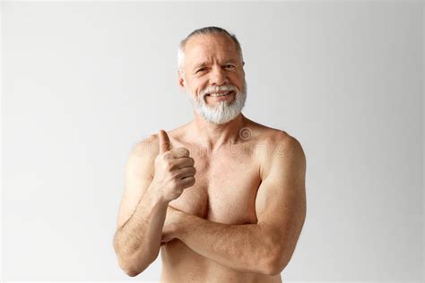 Portrait Of Mature Handsome Bearded Man Posing Shirtless Smiling