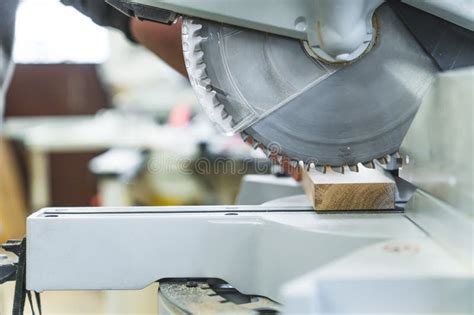 Electric Circular Saw Cutting Wooden Plank In A Carpentry Workshop