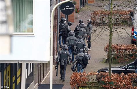 Netherlands Hostage Incident Masked Man Puts His Hands In The Air And