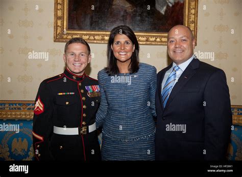 Retired U.S. Marine Corps Cpl. William Kyle Carpenter, center, poses ...