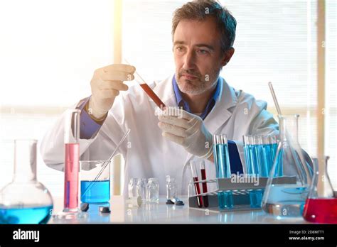 Laboratory Technician Analyzing Blood Samples In Testing Room