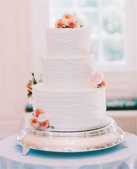 Buttercream Wedding Cake With Strawberry And Vanilla Mousse Filling