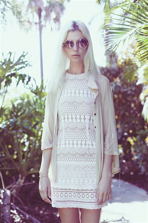 Blonde Standing In Resort Garden In Summer By Stocksy Contributor IMAGE SUPPLY Stocksy