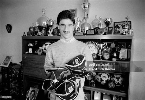 Ian Rush Of Juventus With His Caps And Trophy Cabinet At Home Near