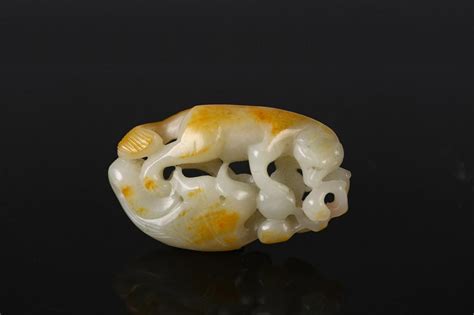 A Reticulated White Jade Carving Of Animal Auction