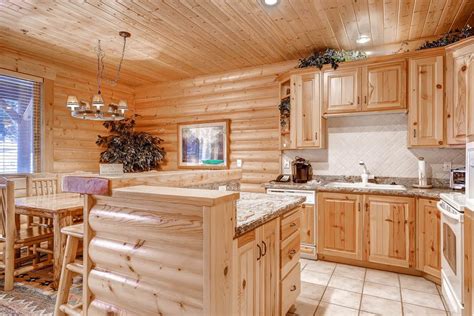 Gourmet Kitchen Decorated In Knotty Pine Cupboards And Granite