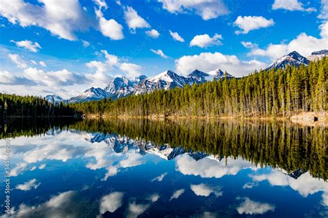 Early Morning Reflections In The Crystal Clear Waters Of Herbert Lake