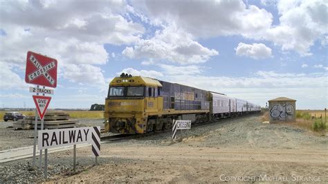 Ma The Overland Passenger Train At Railway Level Crossing