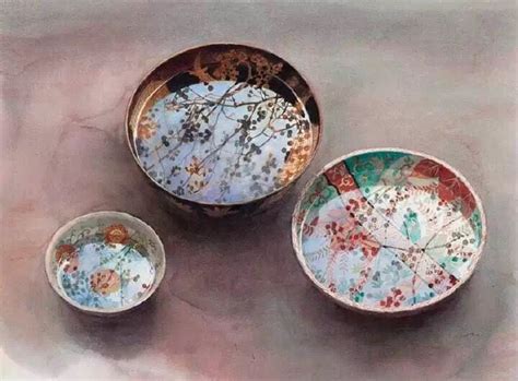 Three Bowls Sitting On Top Of A Table Next To Each Other With Designs