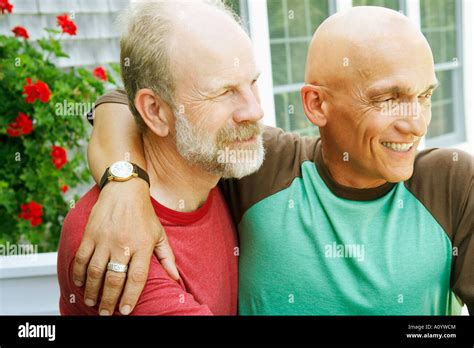 Middle Aged Gay Couple Hugging Stock Photo Alamy