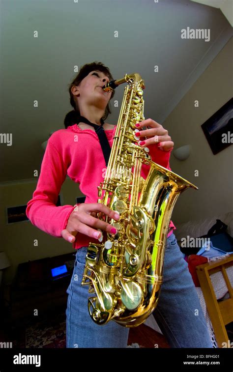 saxophone child playing Stock Photo - Alamy