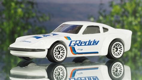 Машинка Базова Hot Wheels Nissan Fairlady Z Greddy Speed Graphics 1 64