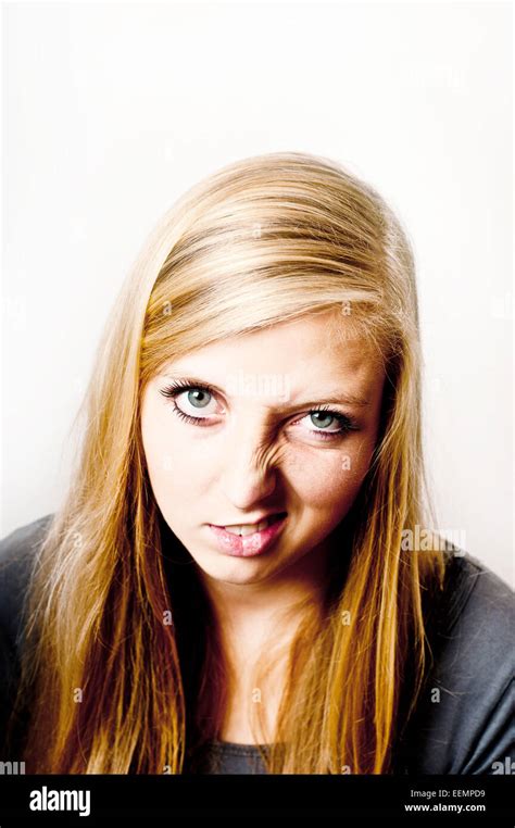 Blond Teenager Girl Making A Funny Disgusted Face Stock Photo Alamy