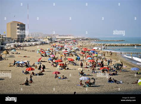 A general view of people on the Eastern Beach Gibraltar Stock Photo - Alamy