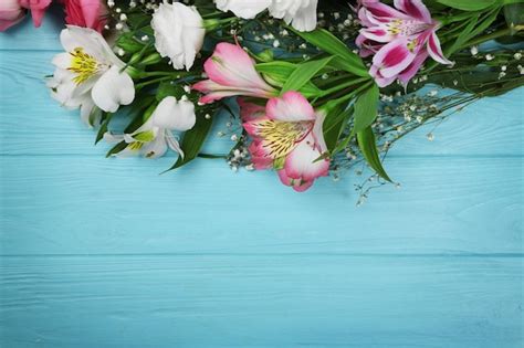 Premium Photo Fresh Flowers On Turquoise Wooden Background