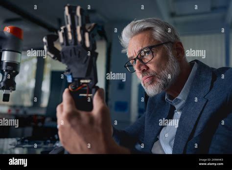 Robotics Engineer Adjusting Calibring Robotic Prosthetic Hand Concept