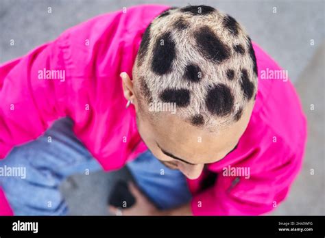 From Above Of Informal Male With Cool Dyed Hair In Pink Jacket And