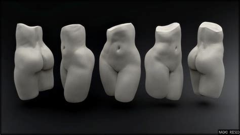 Four Different Sized White Sculptures Sitting Next To Each Other In