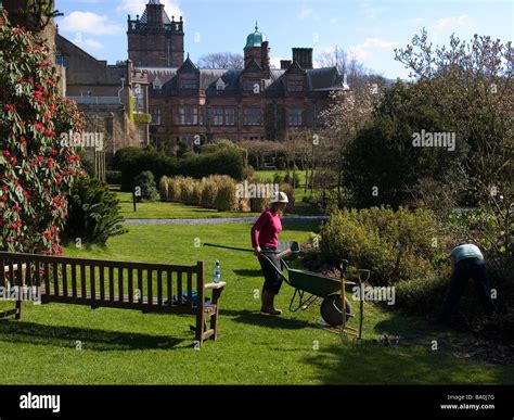 Two Women Gardeners Working In The Formal Gardens In The Estate Of