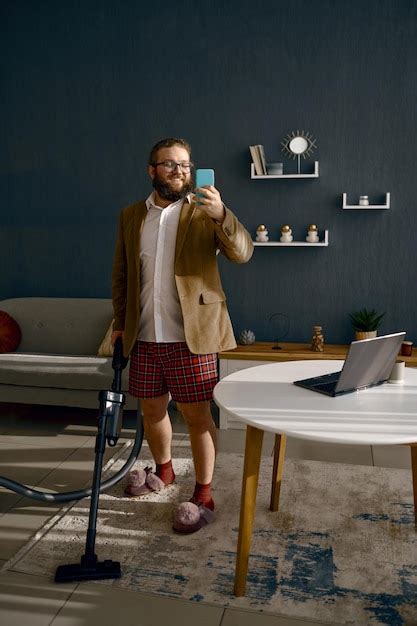 Premium Photo Businessman Having Phone Call Doing Household Chores