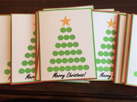 Four Christmas Cards With Green Dots On Them