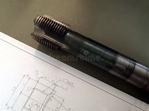 Steel Tap Drill And Drawing On The Production Table Details In