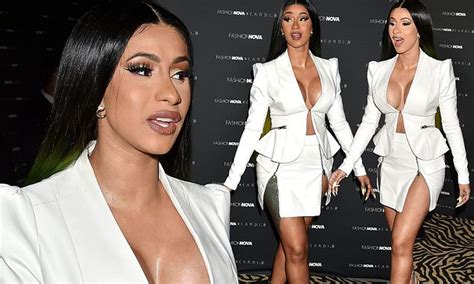 Cardi B Shows Off The Results Of Her Boob Job As She Puts On An Eye