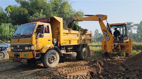 Jcb Backhoe Cutting Soil And Loading In Dump Truck And Tractor Jcb