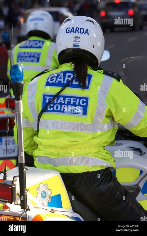 Ponytail Sticking Out From Beneath Helmet Of Female Garda Siochana