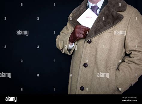 Portrait Of Man In Fur Coat And Leather Gloves Pulling Confidential