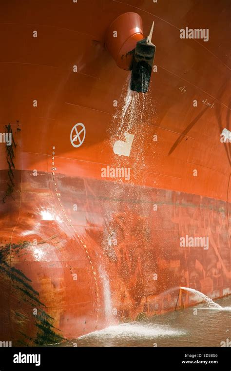 Bulbous Bow On A Red Tanker Cleaning Anchors Stock Photo Alamy