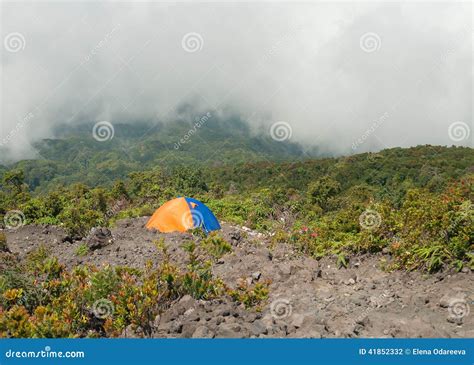 Tent On The Mountain In Fog And Clouds Volcano Mount Merapi Stock