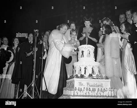 Mrs Franklin D Roosevelt Cuts The Presidents Birthday Cake At A Party In Honor Of The Chief