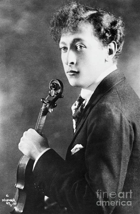 Jascha Heifetz Holding Violin By Bettmann