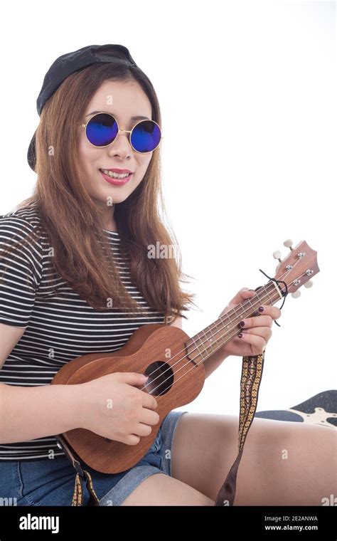 Young Asian Woman Playing Ukulele Isolated On White Background Stock