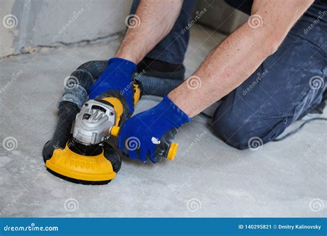 Concrete Floor Surface Grinding By Angle Grinder Machine Stock Image