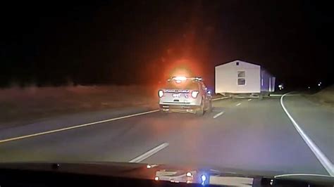 Watch Driver Towing House Leads Police On Wild Chase Iheart