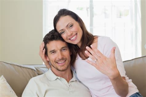 Premium Photo Happy Woman Showing Engagement Ring Besides Man