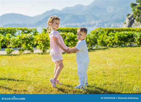 Portrait Of Two Cute Adorable Baby Children Toddlers Hugging And