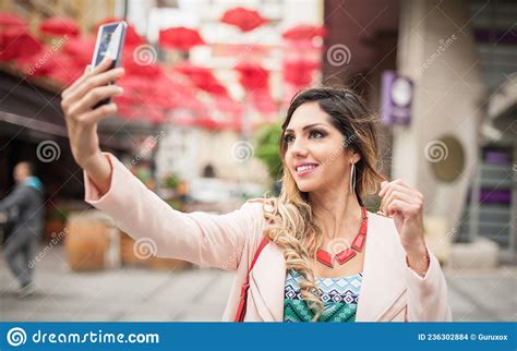 Attractive Young Model Fashion Woman Taking Selfies With Mobile Phones