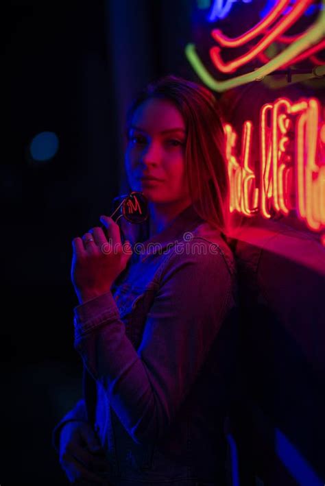 Creative Sexual Portrait Of A Girl In Neon Lighting With Glasses Night