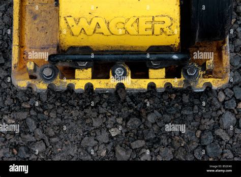 Wacker Plate On Hardcore Stock Photo Alamy