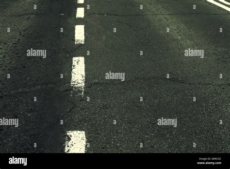 White grunge line on asphalt road Stock Photo - Alamy