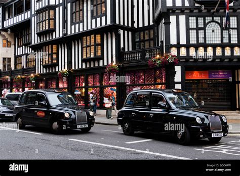 Black London cab in central London Stock Photo - Alamy