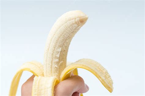 Premium Photo Human Hand Holding Banana Fruit Nutrition Concept