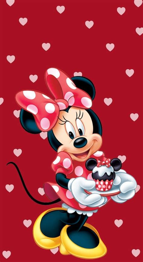 Minnie Mouse Holding A Cake On Top Of A Red Surface With Hearts In The