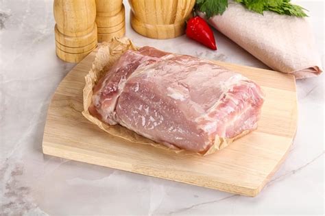 Premium Photo Raw Uncooked Pork Meat Loin Over Board