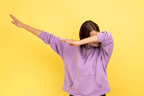 Woman Demonstrating The Dab Dance Posepopular Internet Meme And